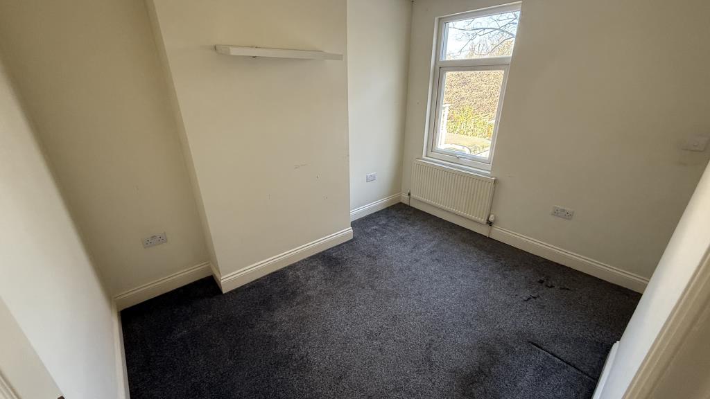 Lot: 133 - VACANT END-TERRACE HOUSE - Inside image of Bedroom 2 from landing